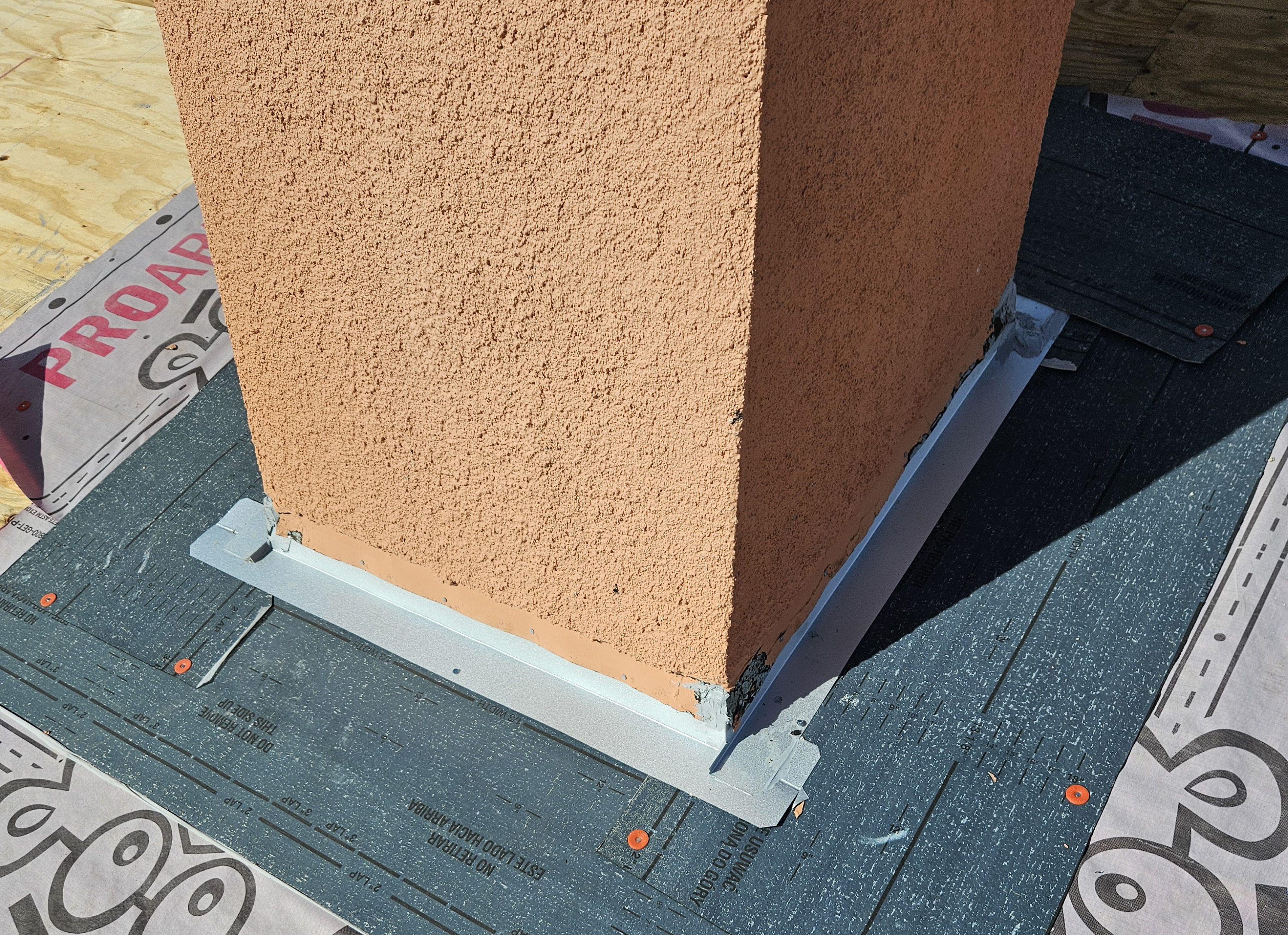 Roofworks chimney flashing repair and sealing, demonstrating precision workmanship and professional-grade materials.
